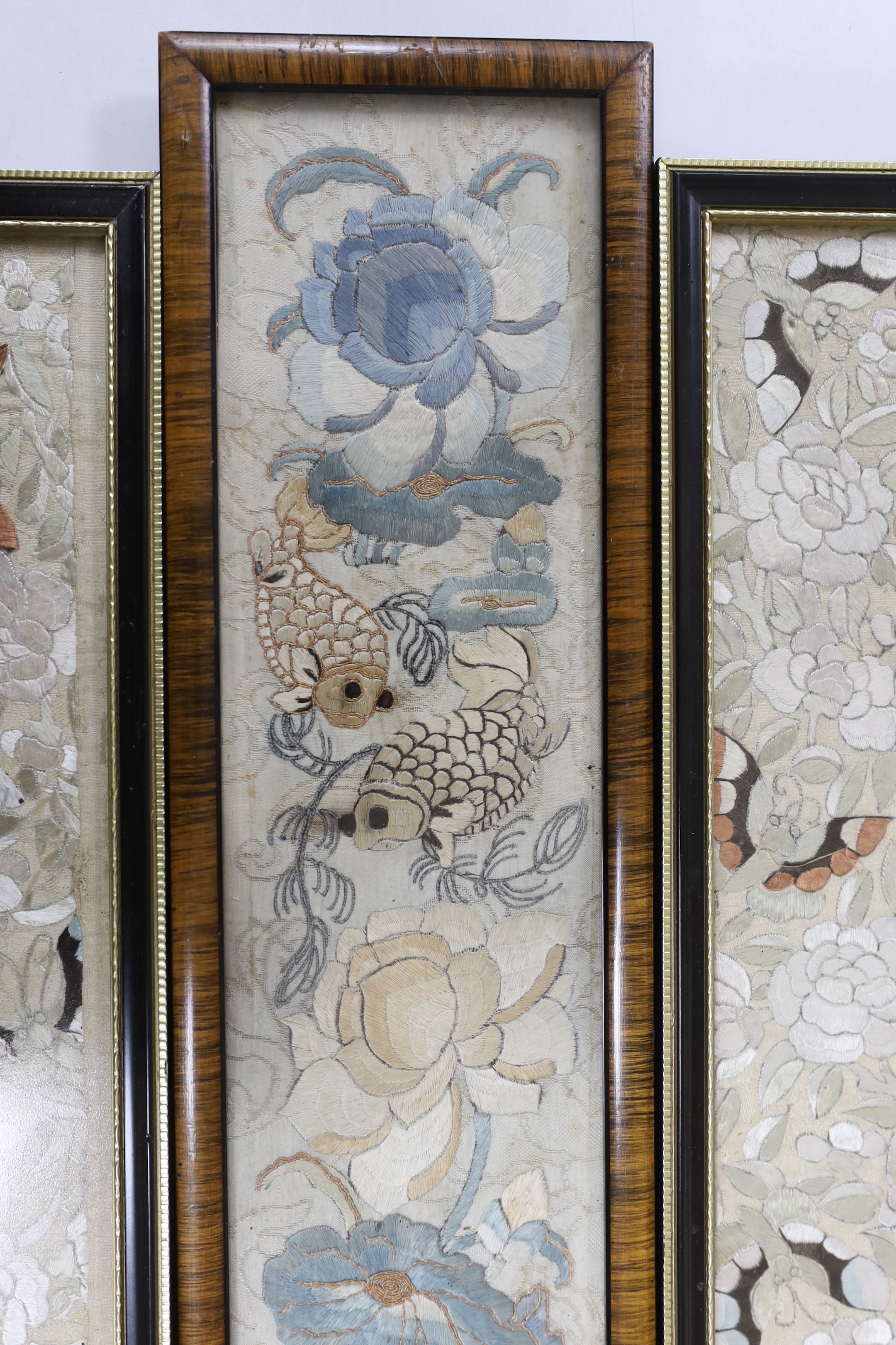 Three 19th century Chinese framed silk panels with embroidered decoration, largest 12 x 55cm